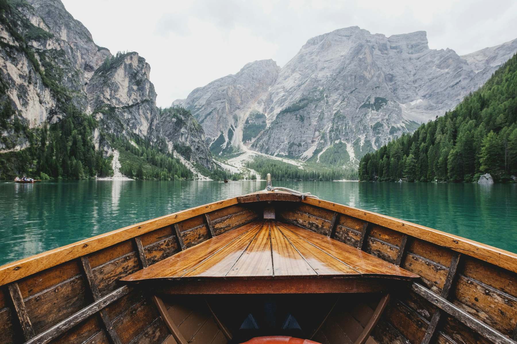 Wooden boat on a still mountain lake